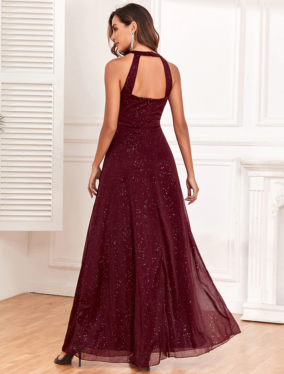Back view of A-Line glitter evening gown with V-back design.