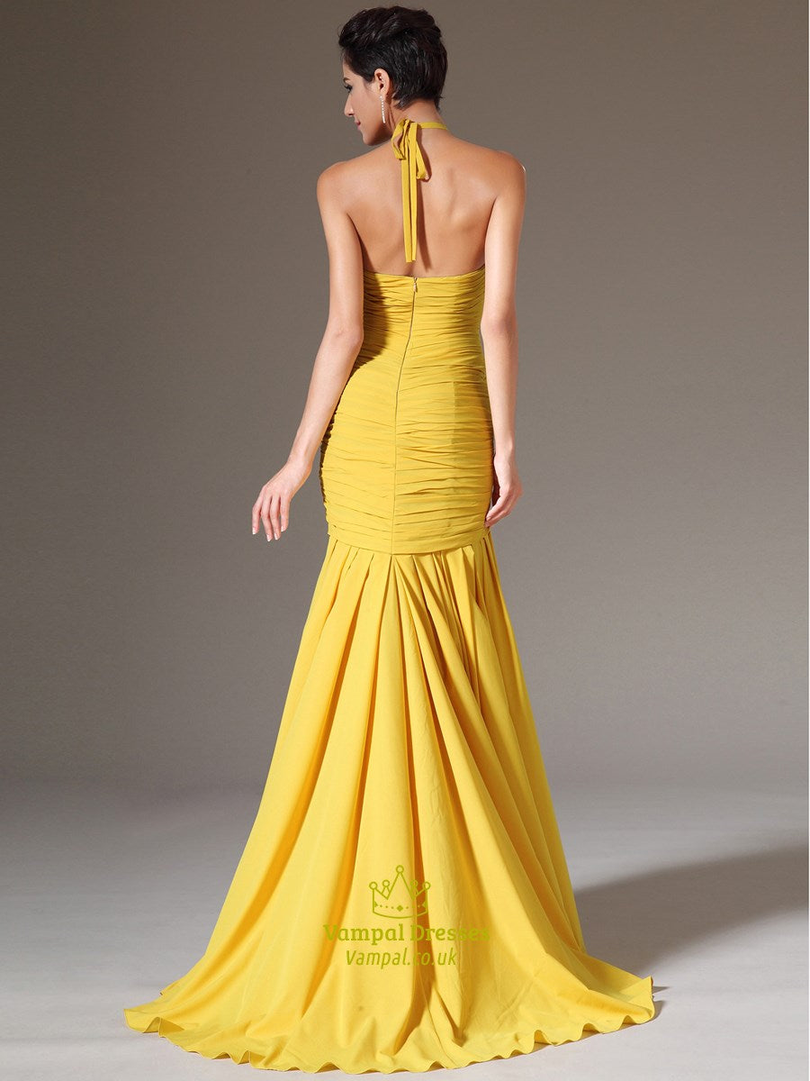 Close-up of the ruched bodice and keyhole detail on the yellow prom dress.