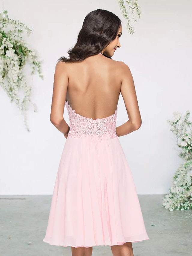 Short A-line bridesmaid dress with lace and pleats.