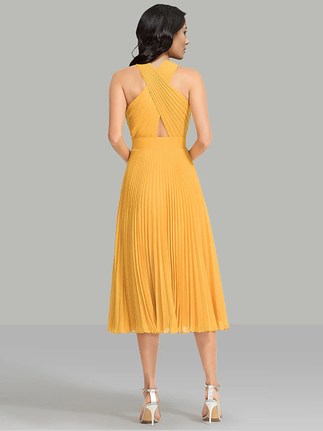 Close-up of ruched halter neckline on a chiffon tea length dress.