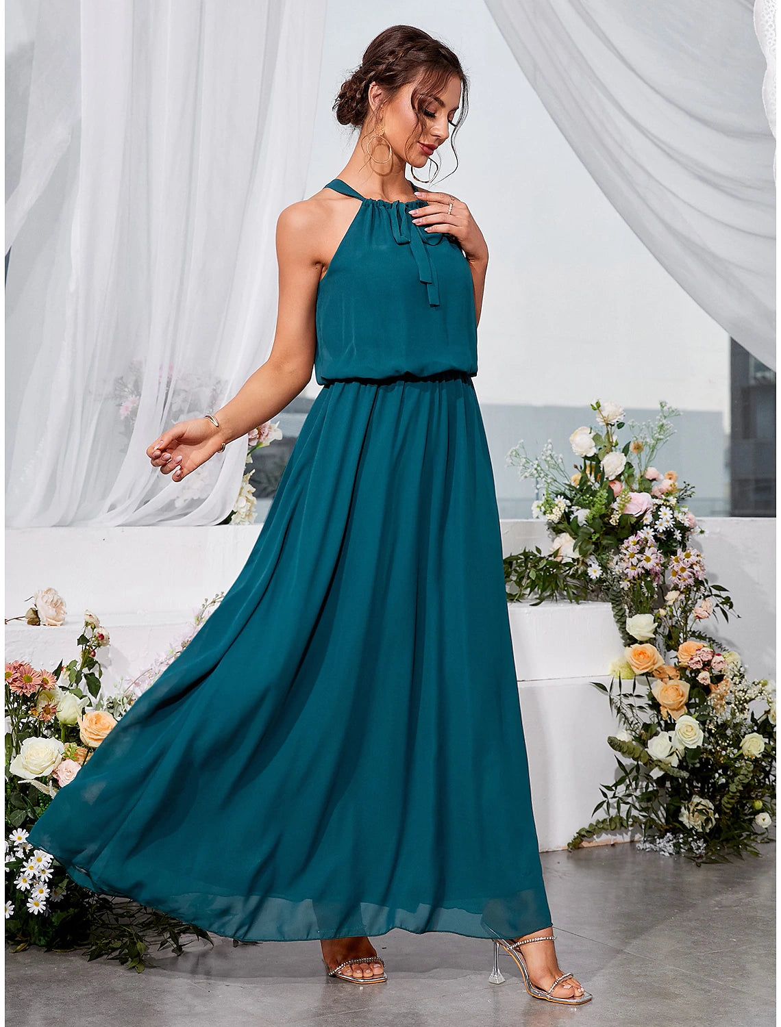 Side profile of the ankle-length lace dress.