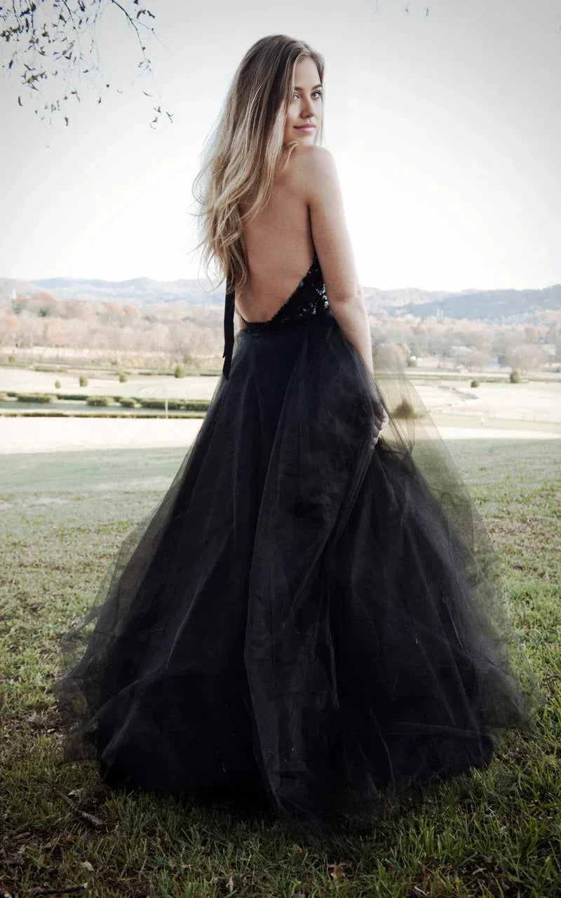 Back view of a backless halter wedding dress with sequin details.