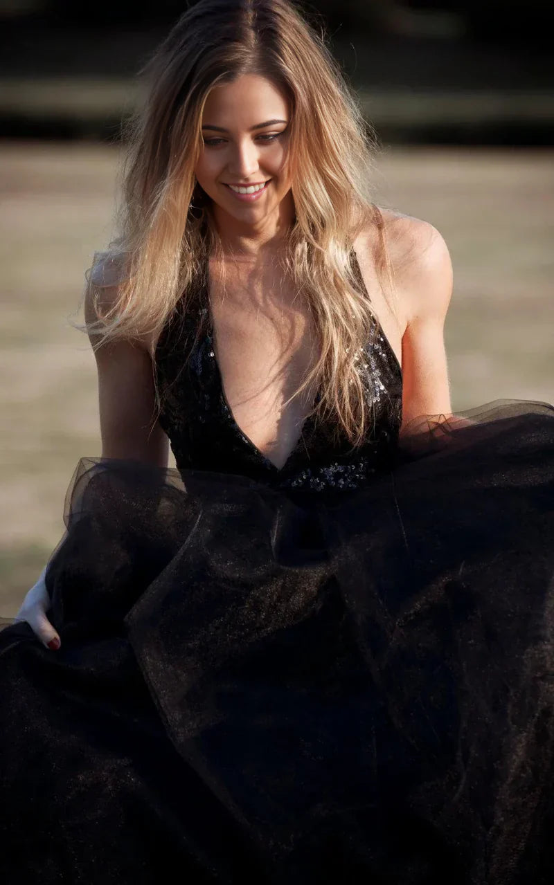 Front view of a V-neck A-line bridal gown with sequin embellishments.