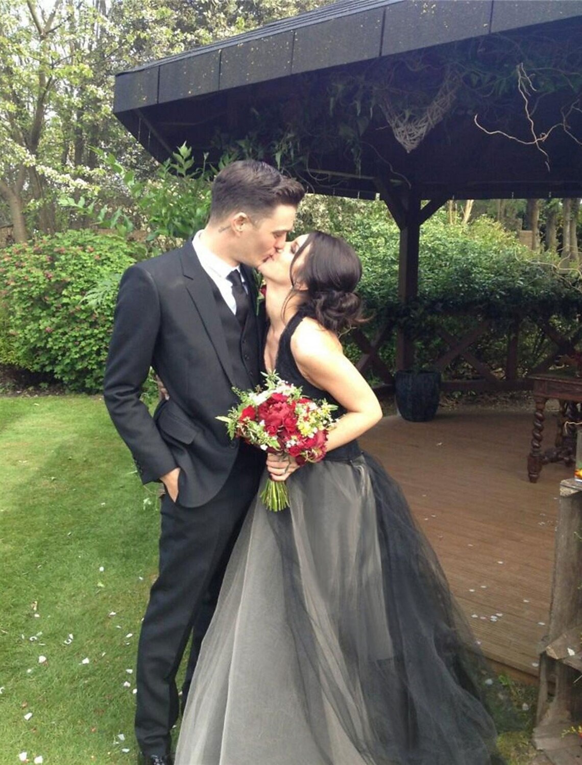 Back view of the black A-line formal gown, showcasing the floor-length skirt.