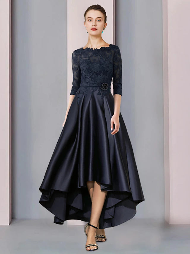 Model wearing an elegant A-Line high-low tea length Mother of the Bride dress with a scoop neck and 3/4 sleeves, front view.