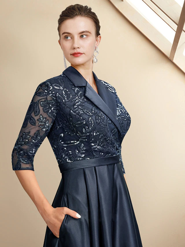 Back view of an elegant A-line high-low tea length mother of the bride dress, showcasing the asymmetrical hem and flowing.