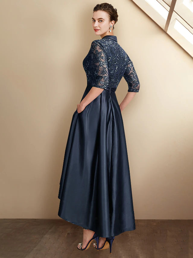 Close-up of the elegant A-line mother of the bride dress, highlighting the satin, lace, and sequin appliques.