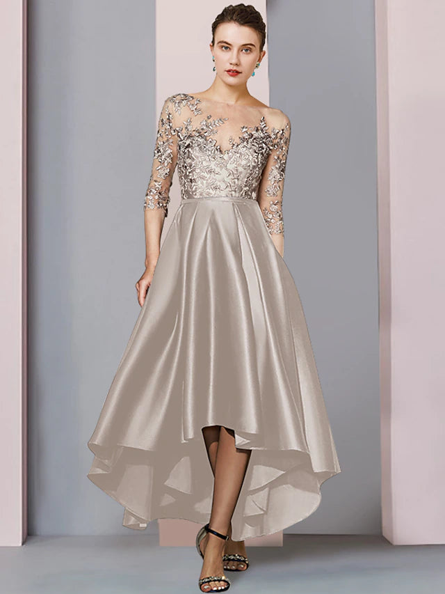 Elegant A-line high-low tea length satin lace dress with half sleeves and scoop neck, shown on a model.