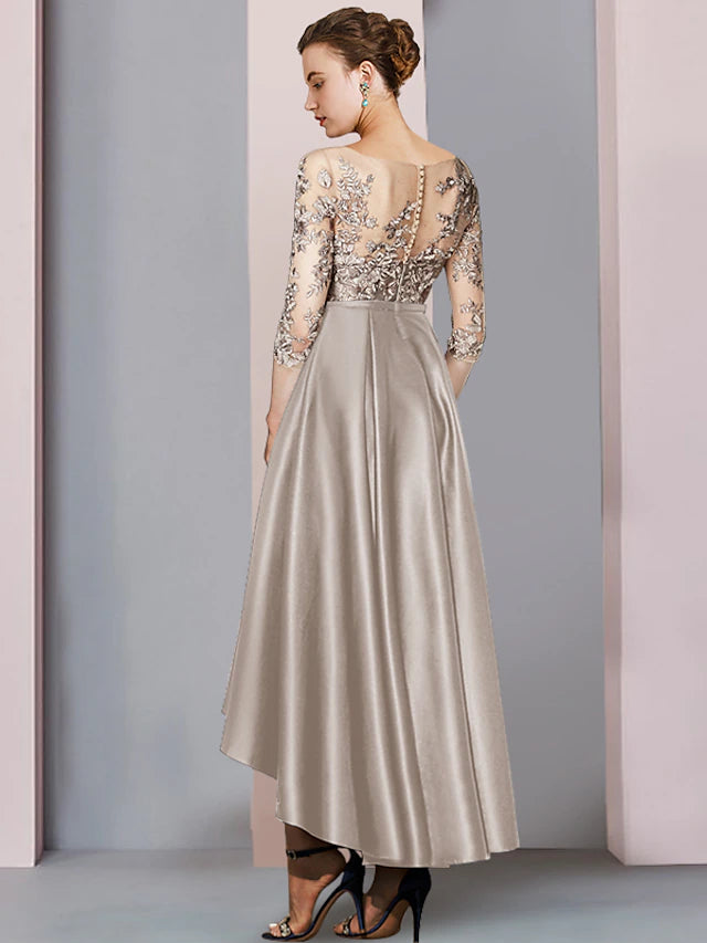 Back view of the elegant A-line high-low tea length satin lace dress, featuring pleats and appliques.
