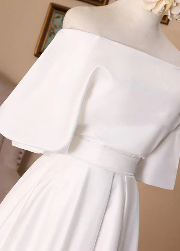 Back view of the elegant white A-line wedding dress, showing high neck and half sleeves.