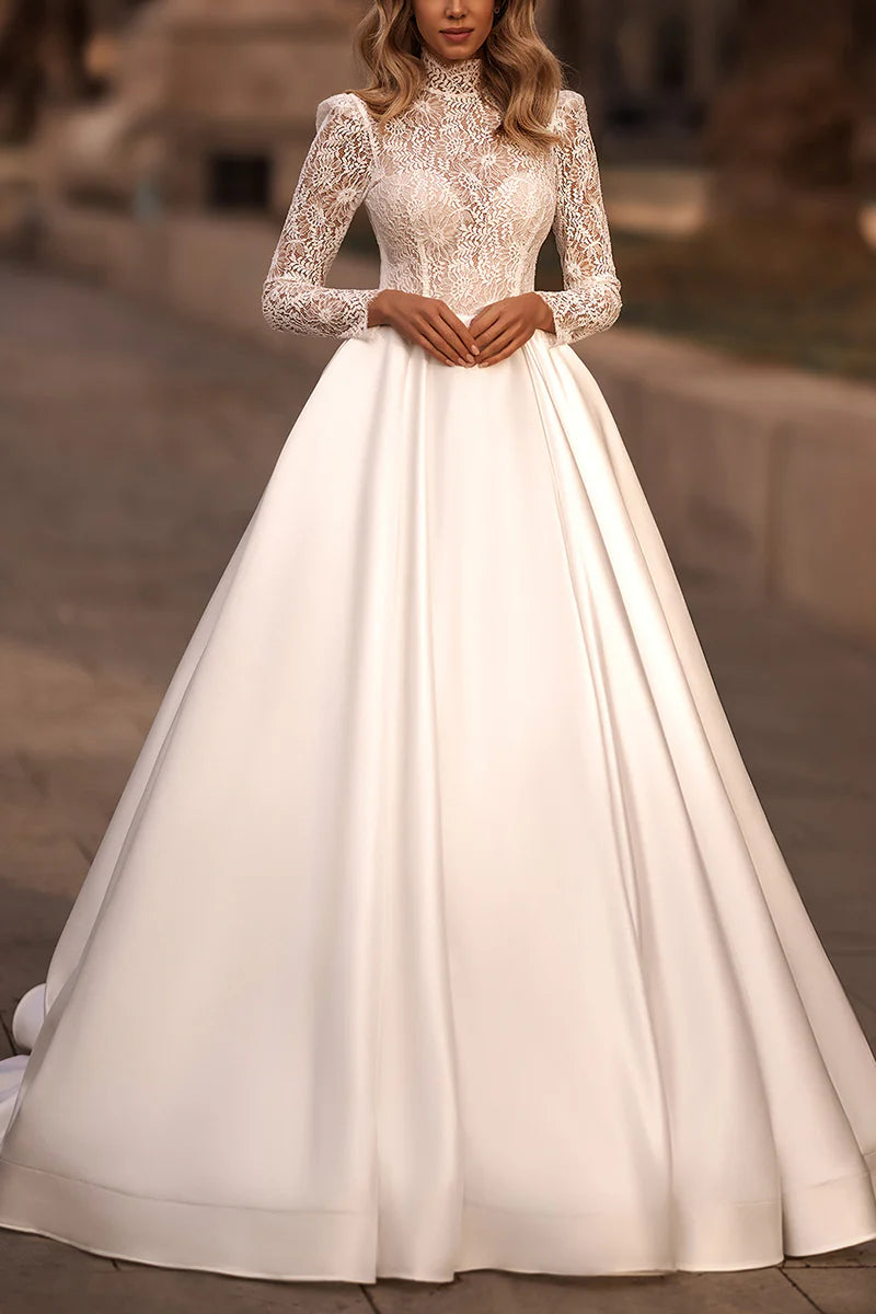 Bride in an elegant A-line high neck lace long sleeve wedding dress.