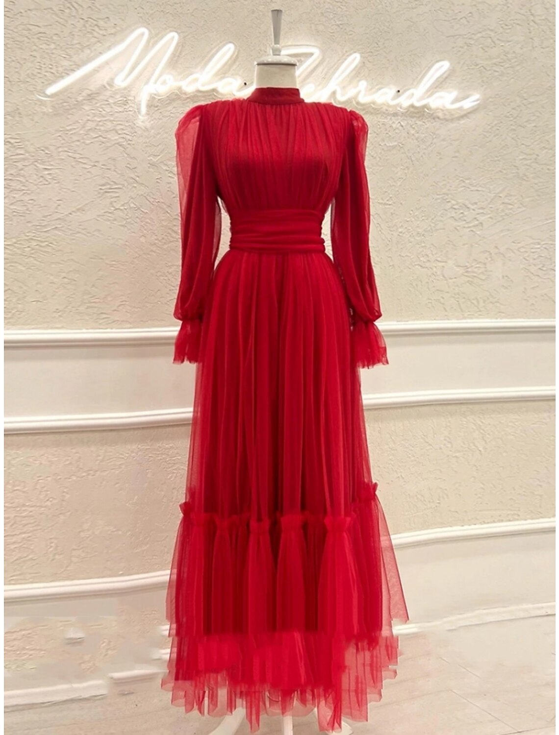 Full length view of the formal ankle-length dress.