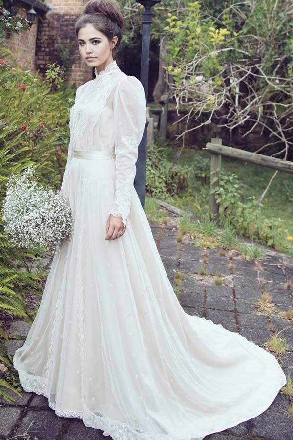 Elegant A-line high neck wedding dress with long lace sleeves and appliques.
