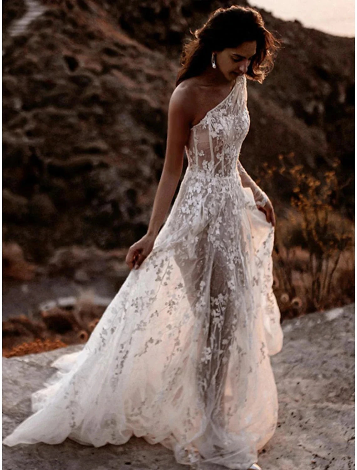 Back view of a pleated chiffon high neck bridal gown.