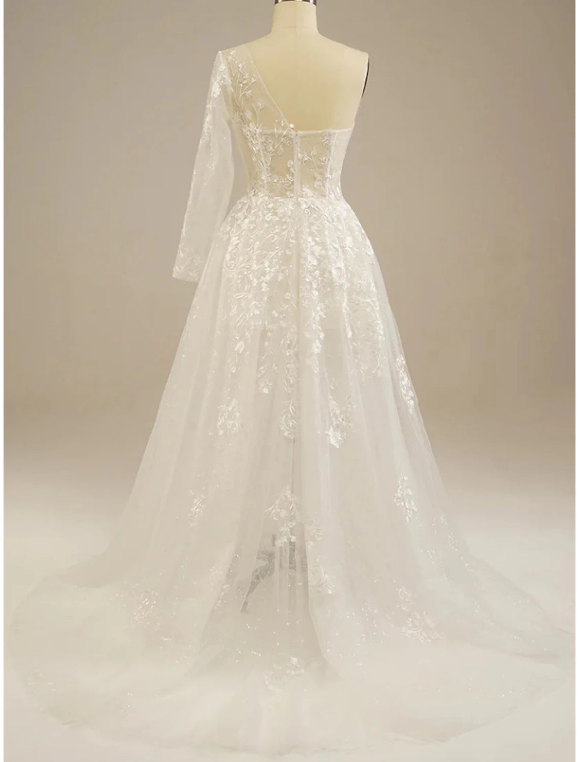 Detail of the tea length hem and solid white chiffon fabric.