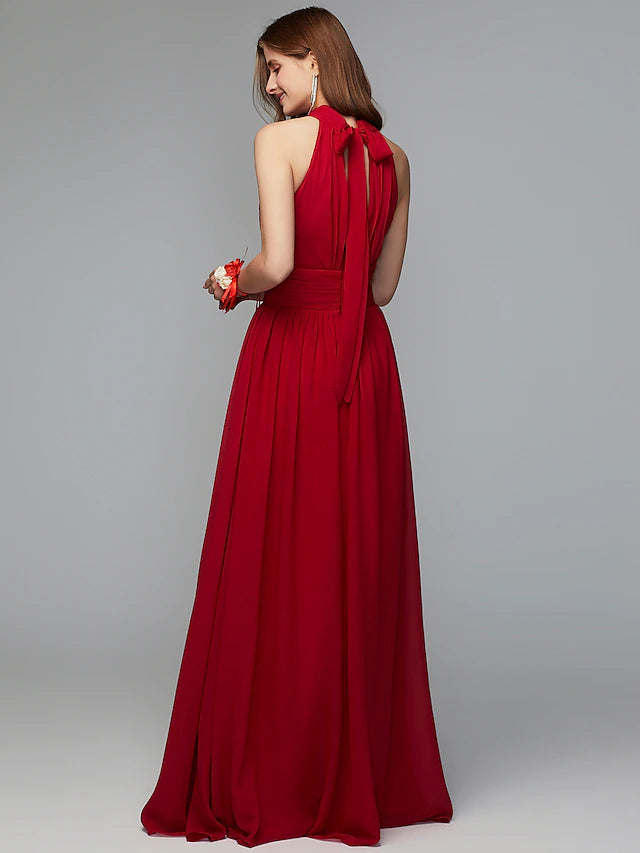 Close-up of the pleated chiffon fabric and high neckline on the dress.