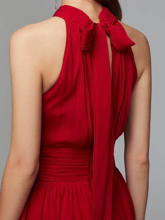 Full length view of the high neck sleeveless dress with a split front.