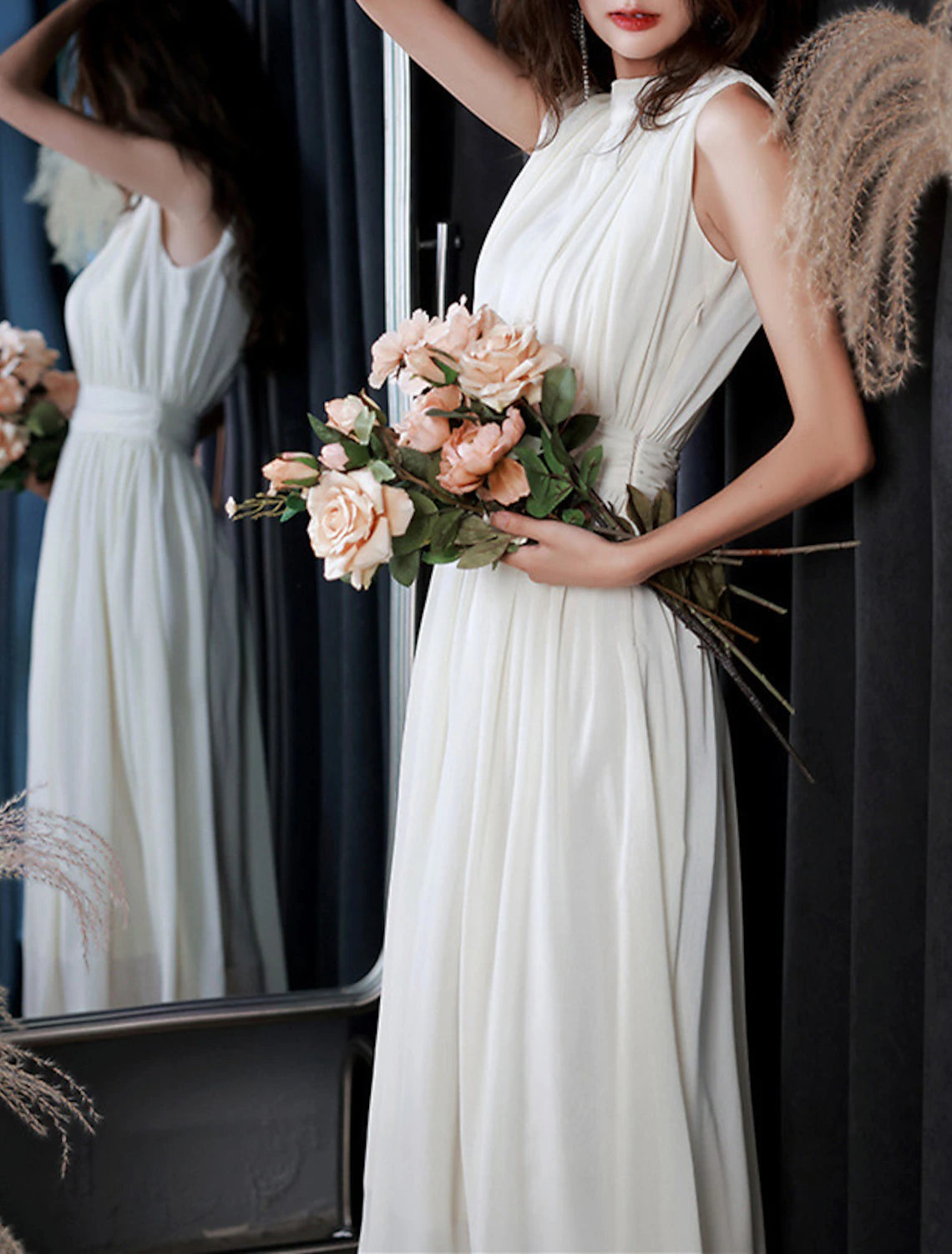 Full length view of a white tea length chiffon dress, ideal for bridal events.