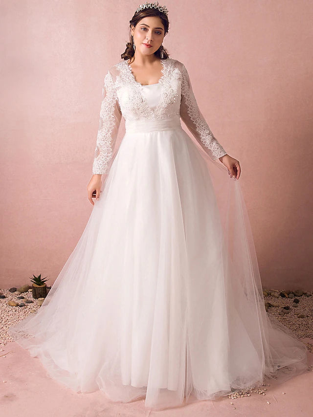 Elegant A-line satin wedding dress with long illusion sleeves and a court train.
