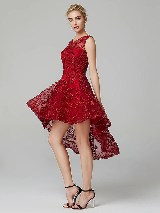 Close-up of intricate appliques and sheer tulle fabric on the dress.