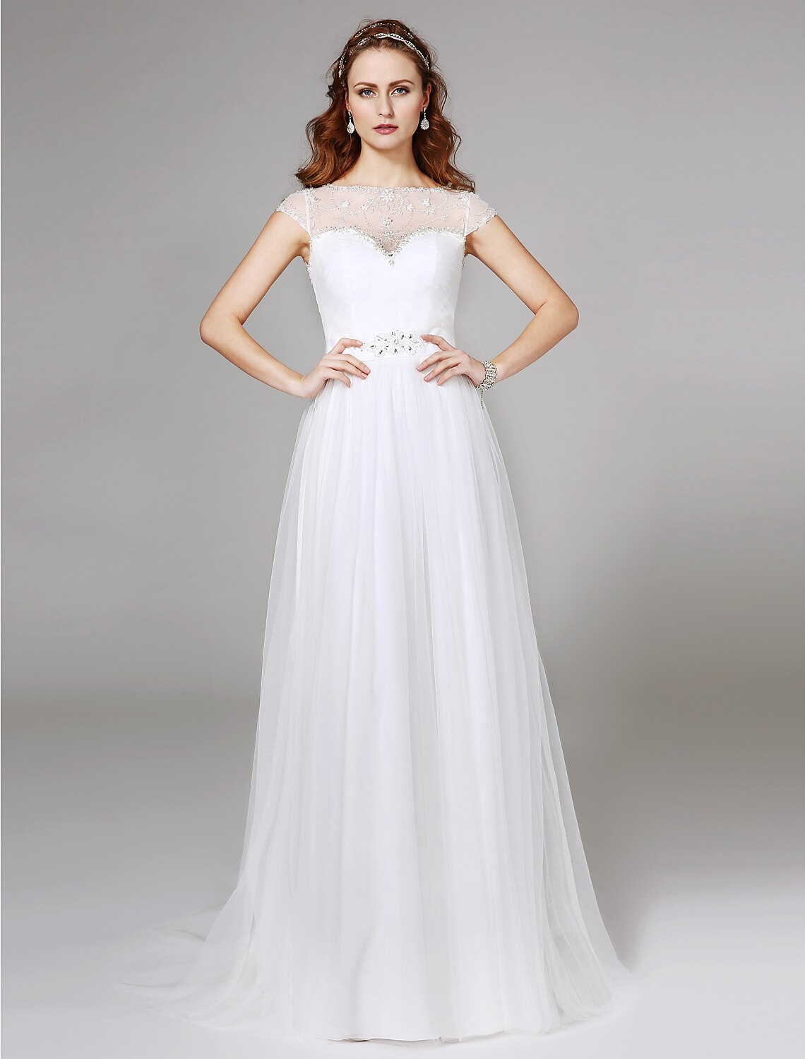 Front view of an elegant A-line illusion neck tulle wedding dress with beading and lace.