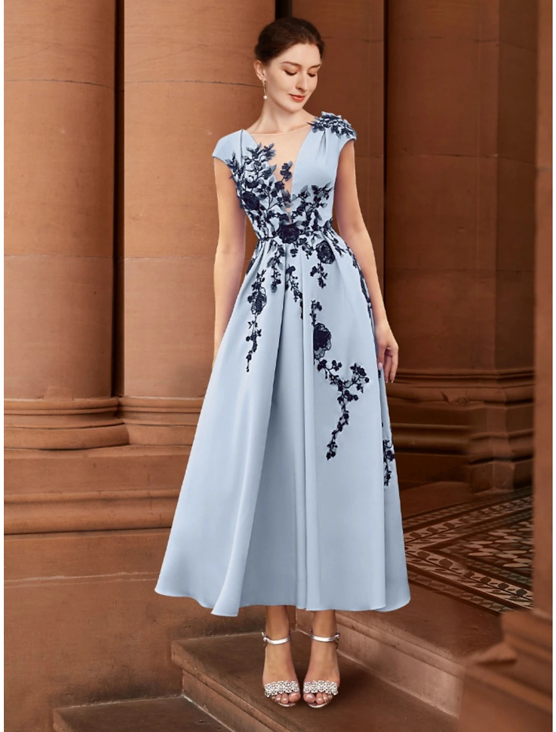 Elegant A-Line Mother of the Bride dress with illusion neck and cap sleeves.