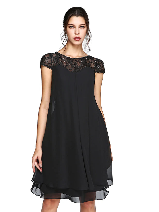 Plus size A-line Mother of the Bride dress with illusion neck, short sleeves, chiffon, lace, and sequin details.
