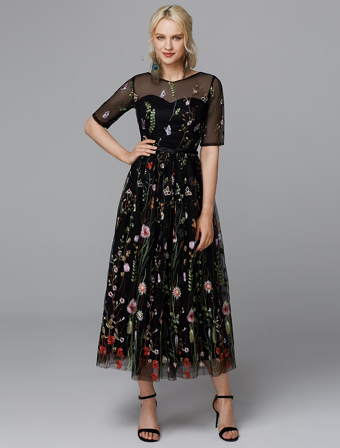 White A-line tea length dress with lace and half sleeves.