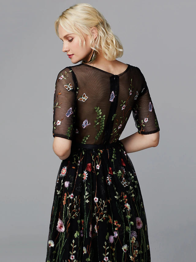 Side view of white A-line tea length dress with half sleeves.