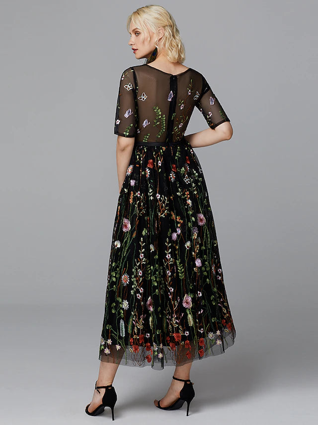 Back view of white A-line dress with lace details.