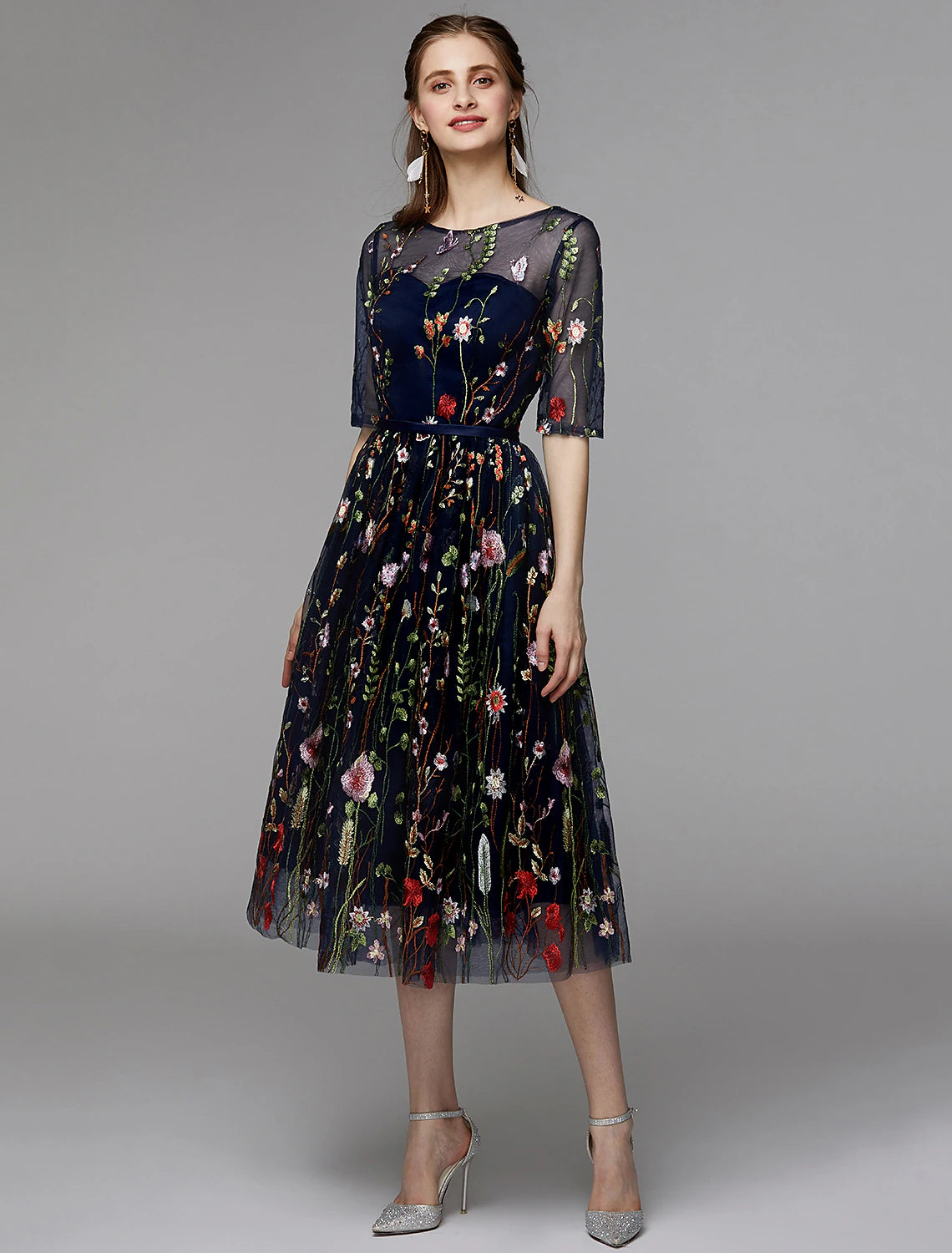 Elegant A-Line tea length party dress with illusion neck and half sleeves.