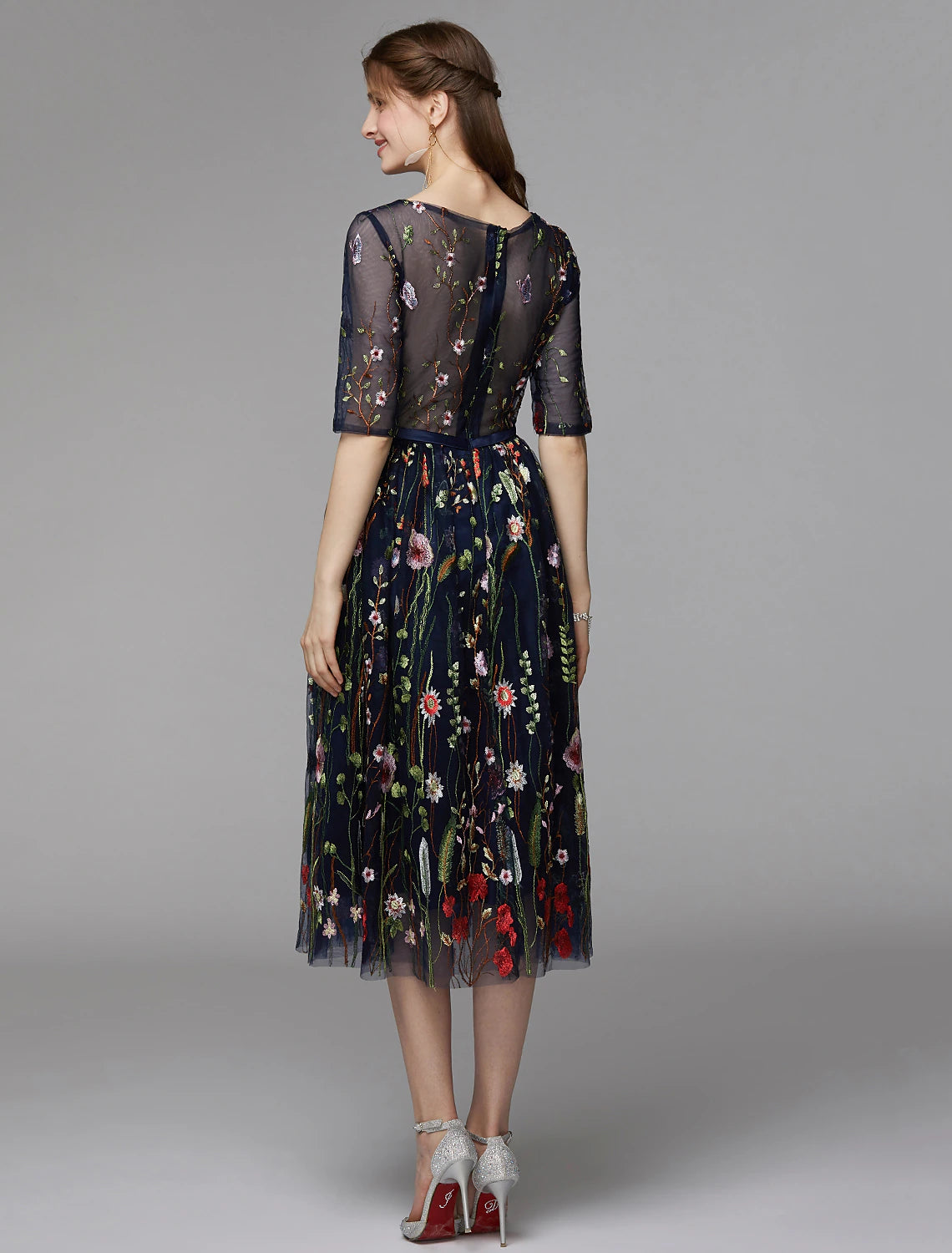 Elegant A-Line tea length party dress with illusion neck and half sleeves.