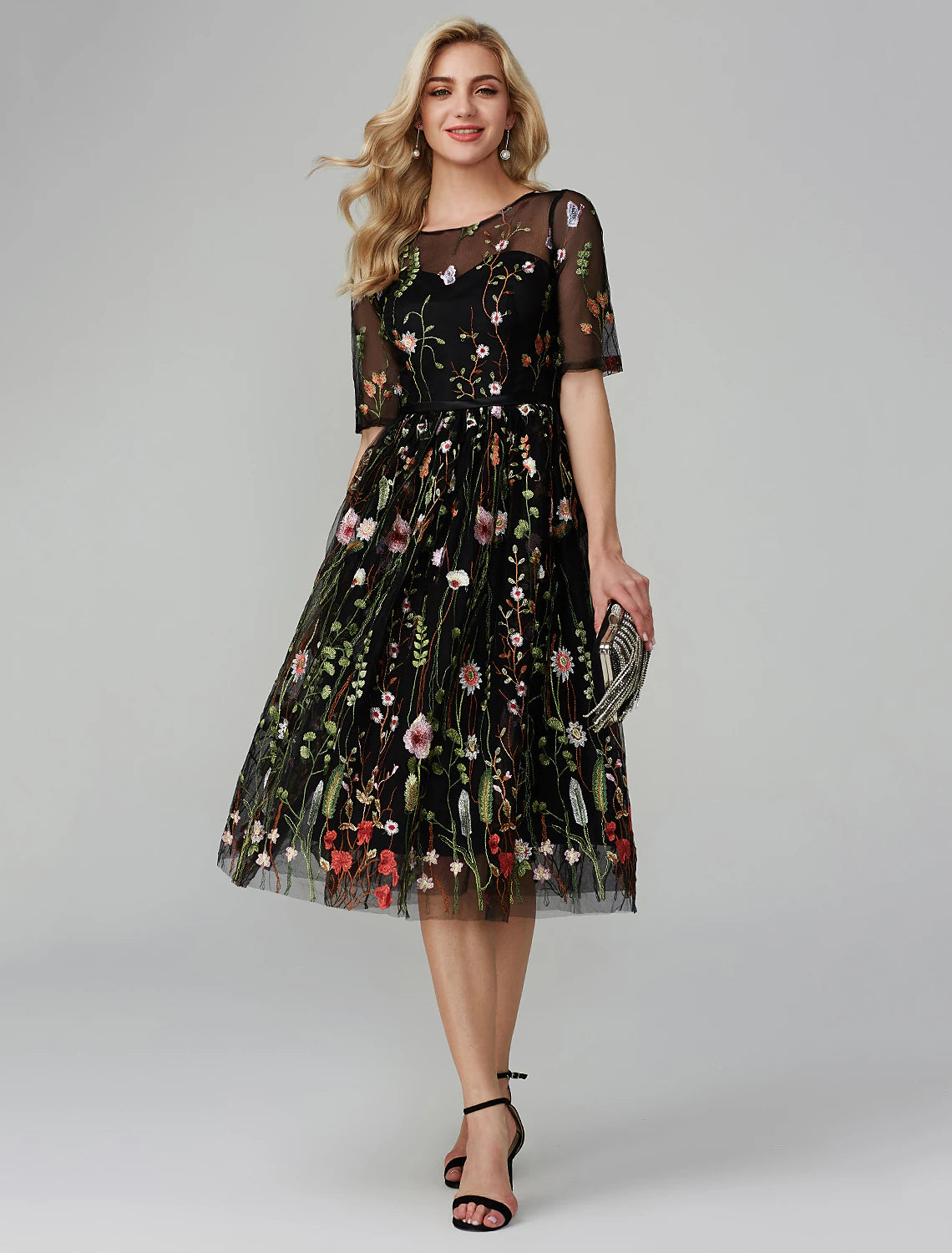 Elegant A-Line tea length party dress with illusion neck and half sleeves.