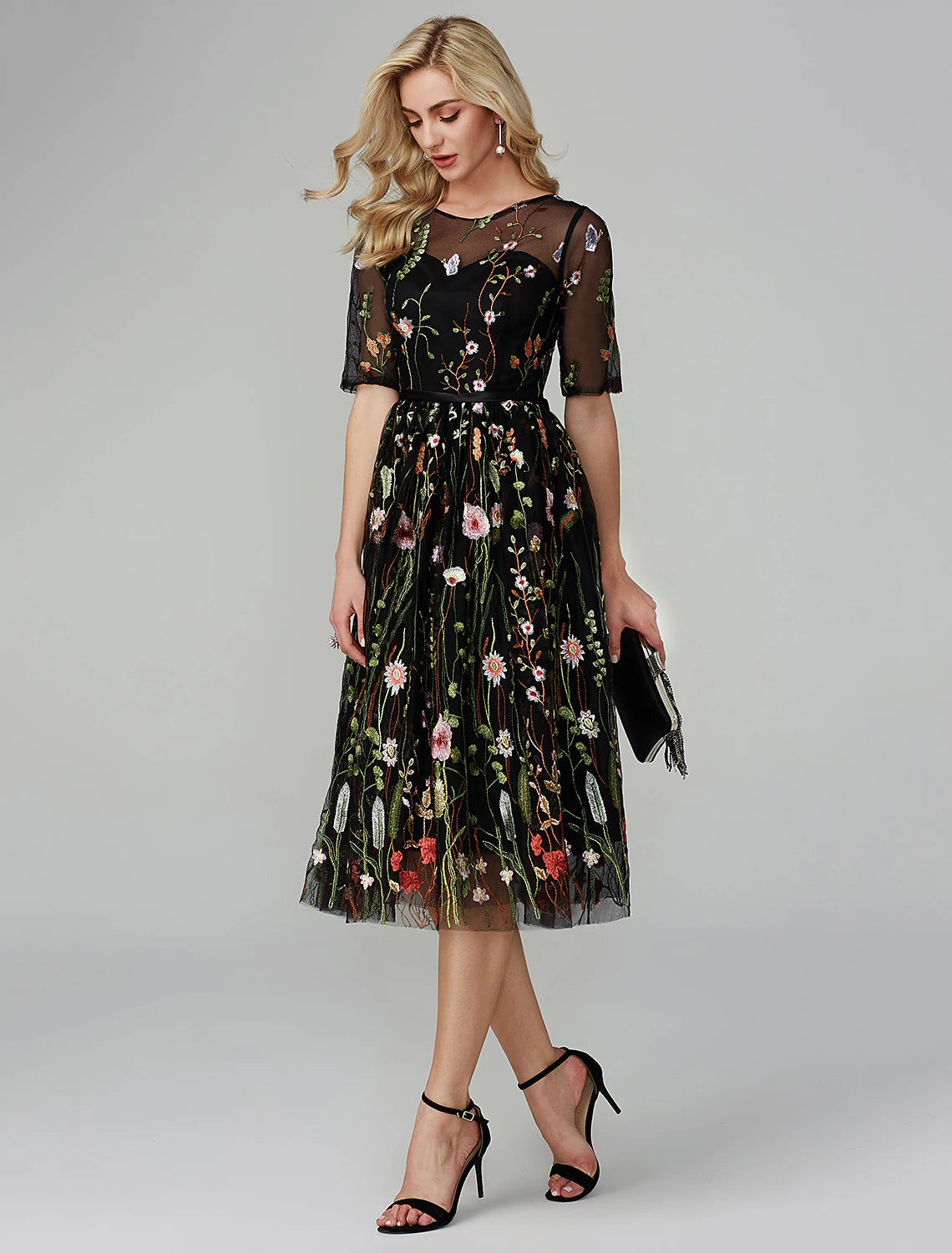 Elegant A-Line tea length party dress with illusion neck and half sleeves.