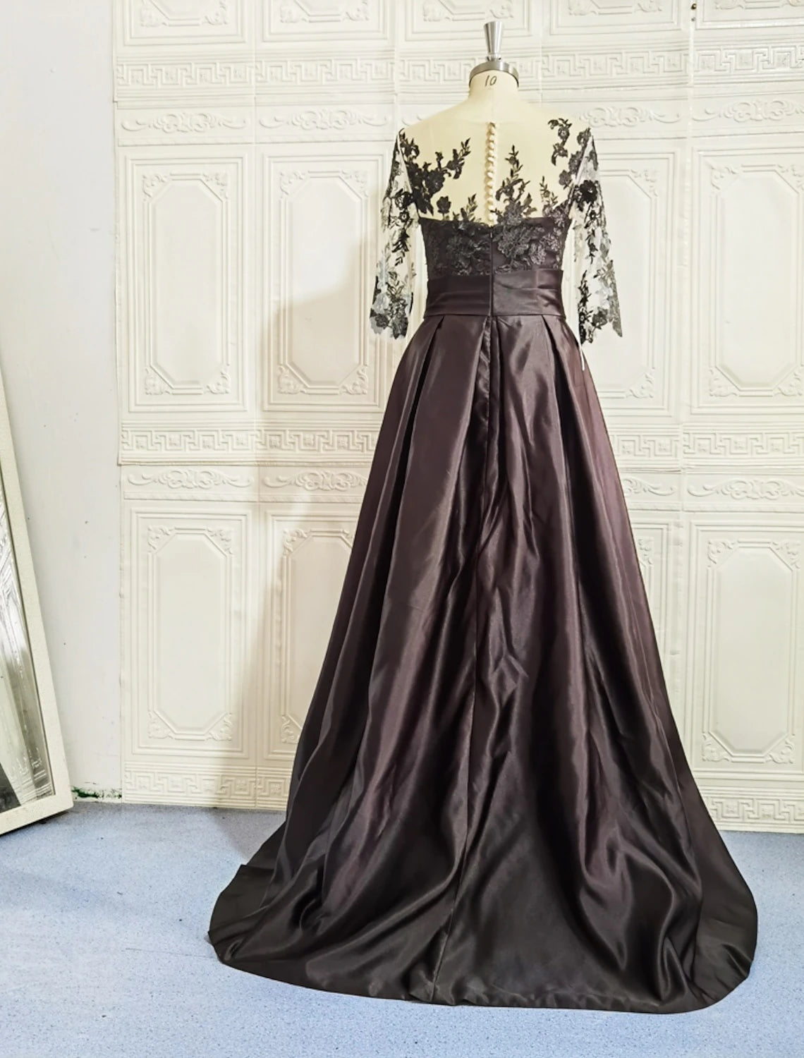Back view of the A-line satin gown, showcasing the sweep train.