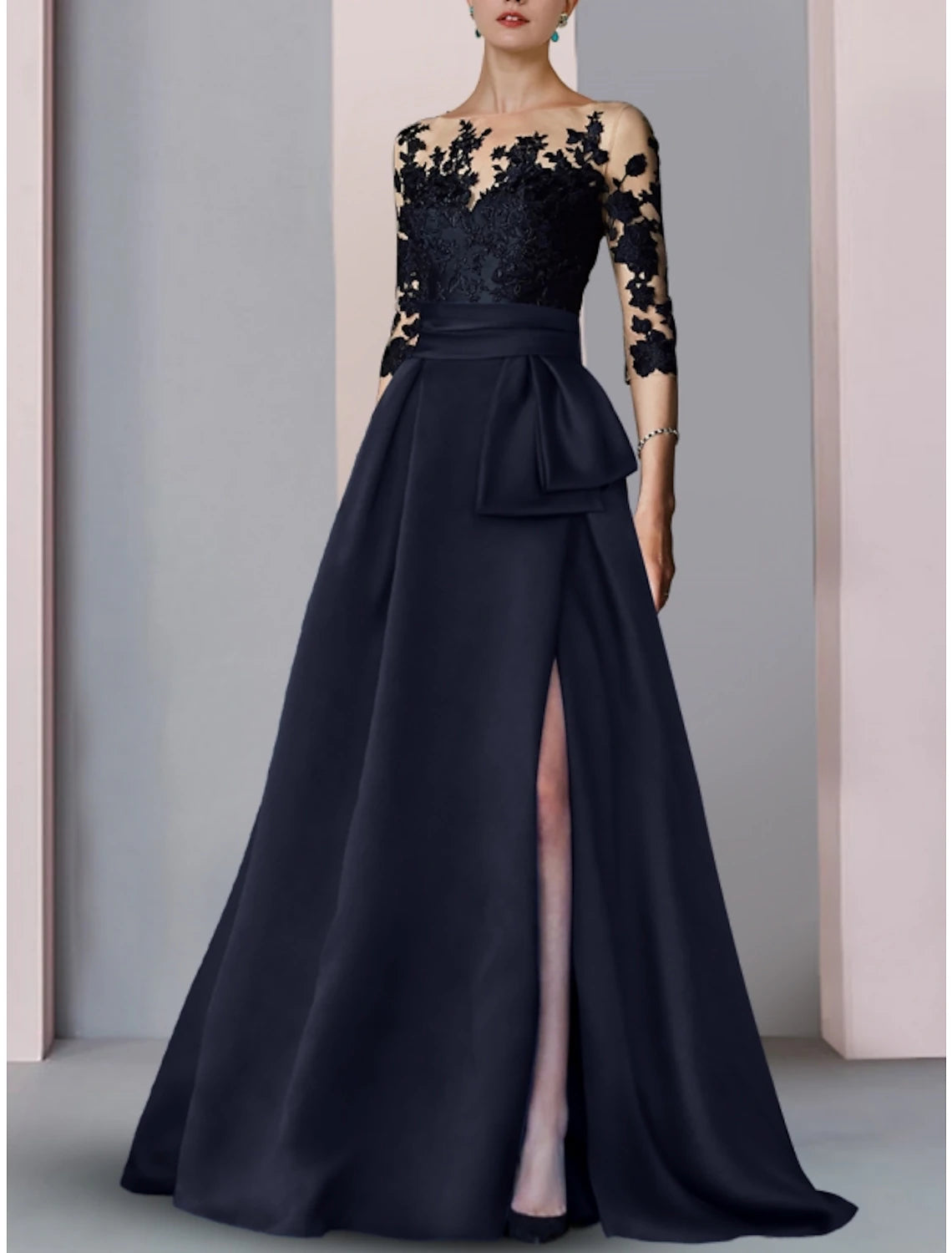 Close-up of the illusion neckline and half sleeves on the satin gown.