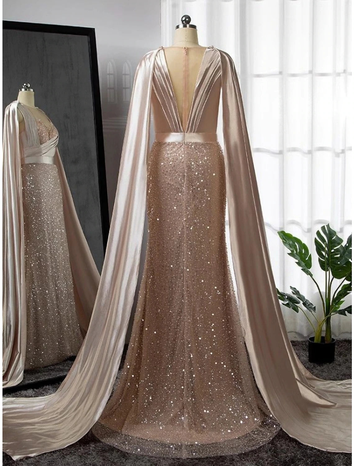 Close-up of illusion neckline and beaded bodice on formal gown.
