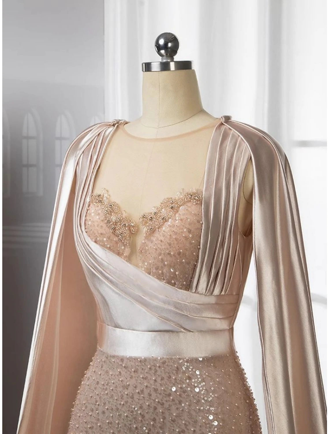 Back view of A-Line evening gown showing court train and ruching.
