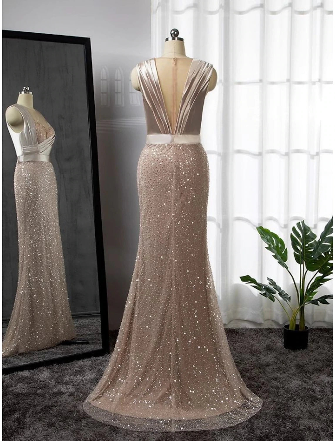 Side profile of A-Line formal dress with long sleeves and flowing skirt.