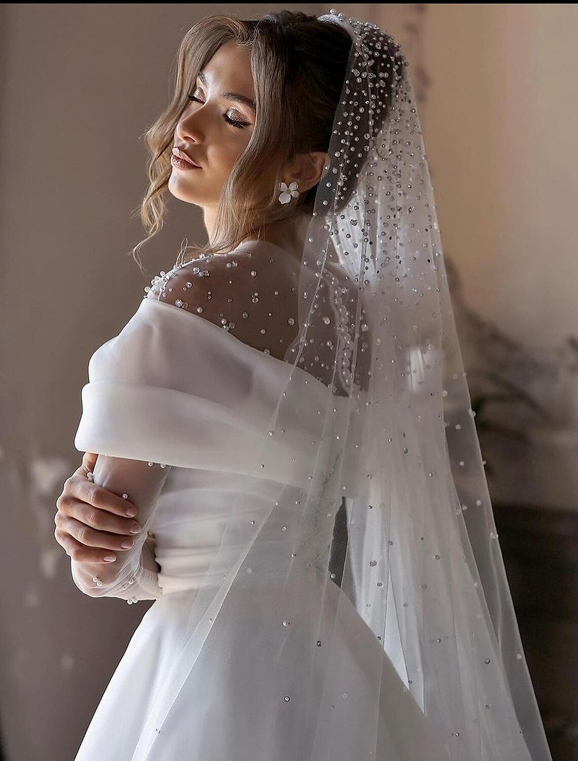 Back view of the A-Line tulle bridal gown with ruched beading.