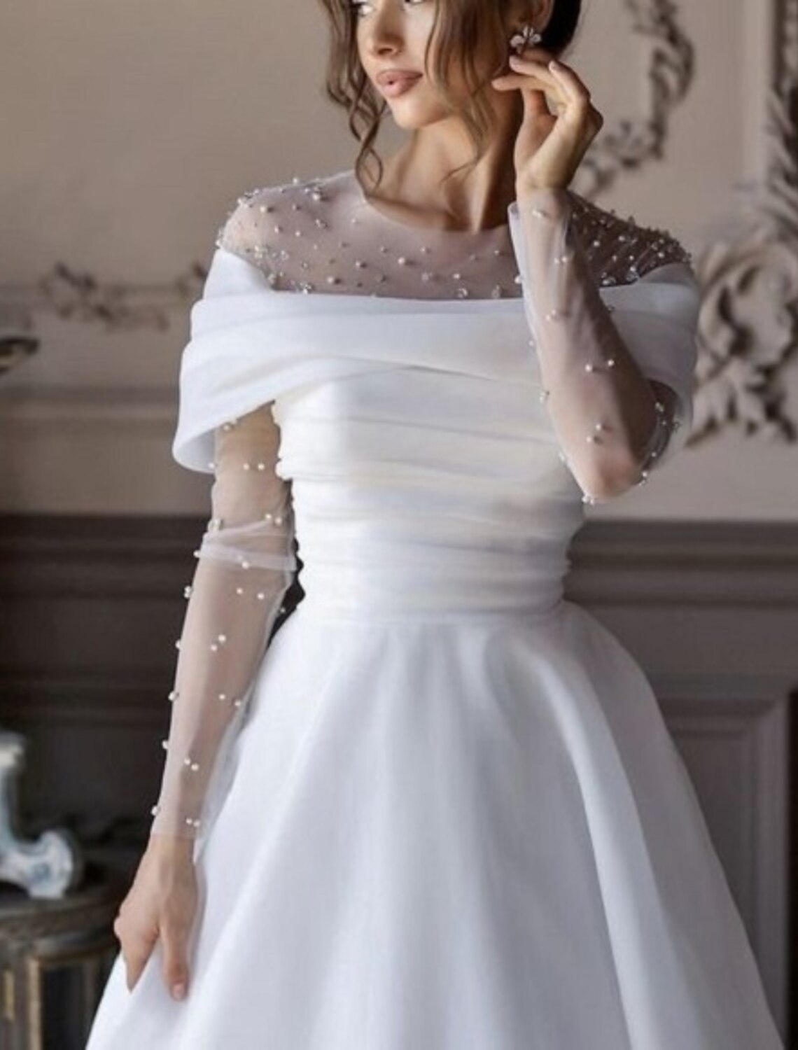 Full length view of the white A-Line formal gown.