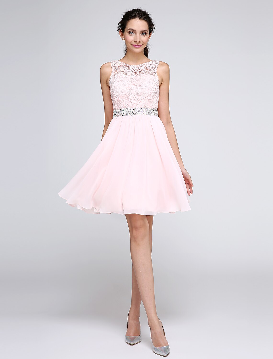 Front view of an elegant pink A-line cocktail dress with an illusion neckline and crystal embellishments.