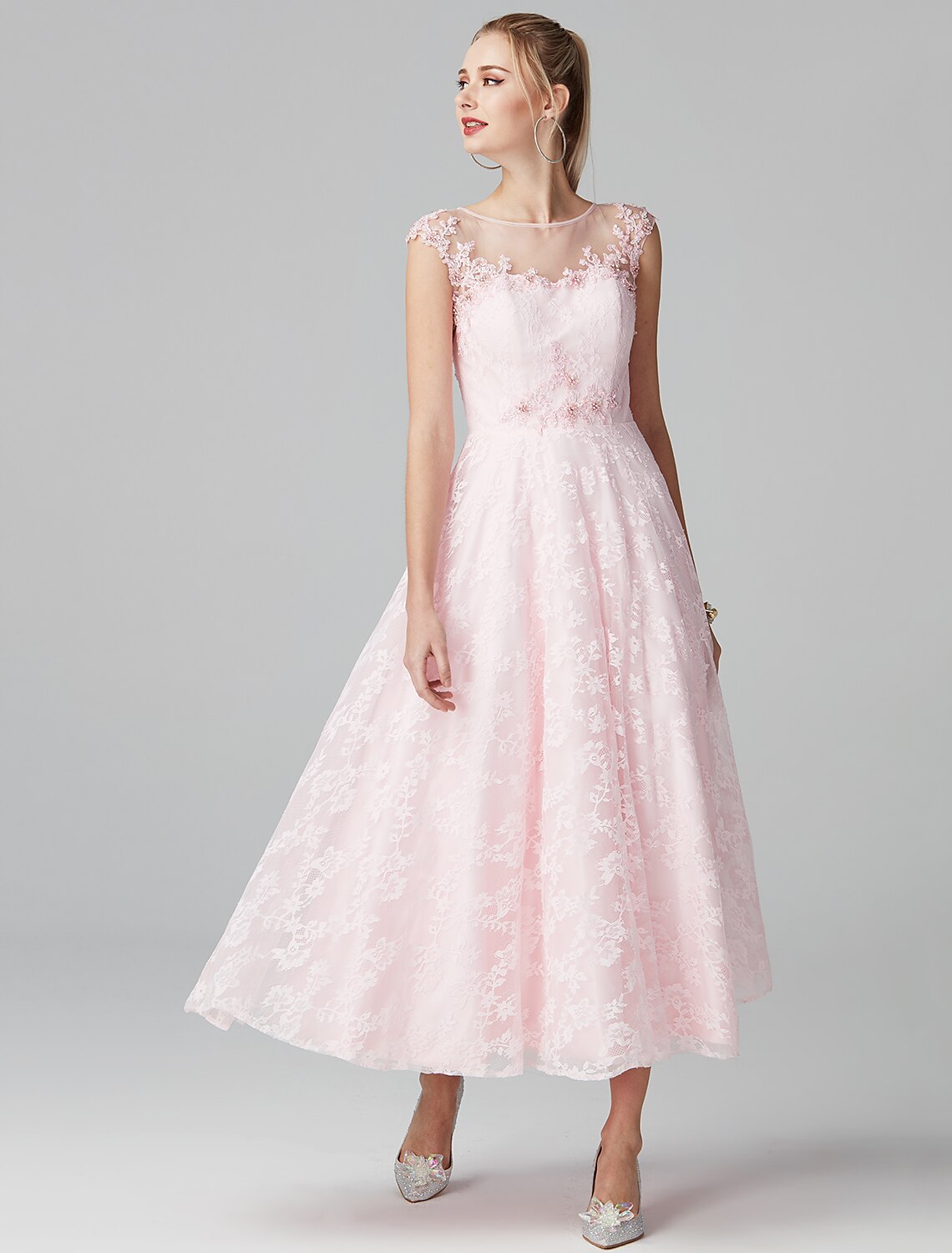The floral lace pattern on the ankle-length dress.