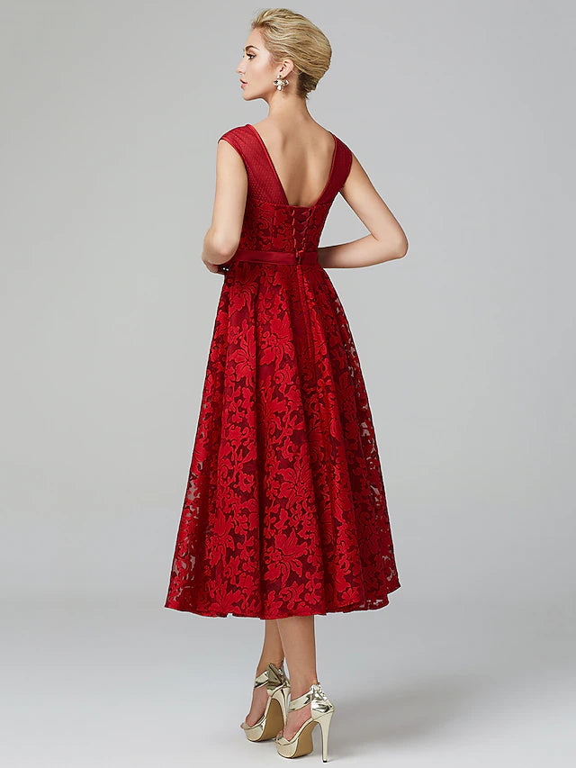 Back view of the A-line floral lace tea length cocktail dress.