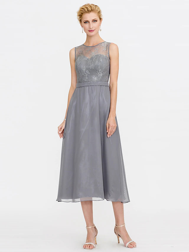Close-up of the illusion neckline and corded lace on the mother of the bride dress.