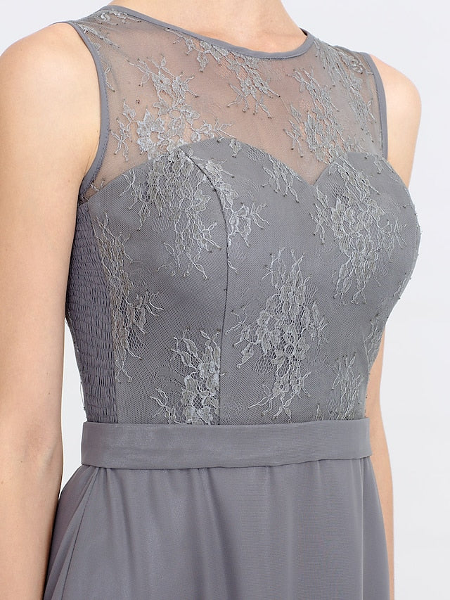 Detail of the lace pleats and tea length hem of the elegant dress.