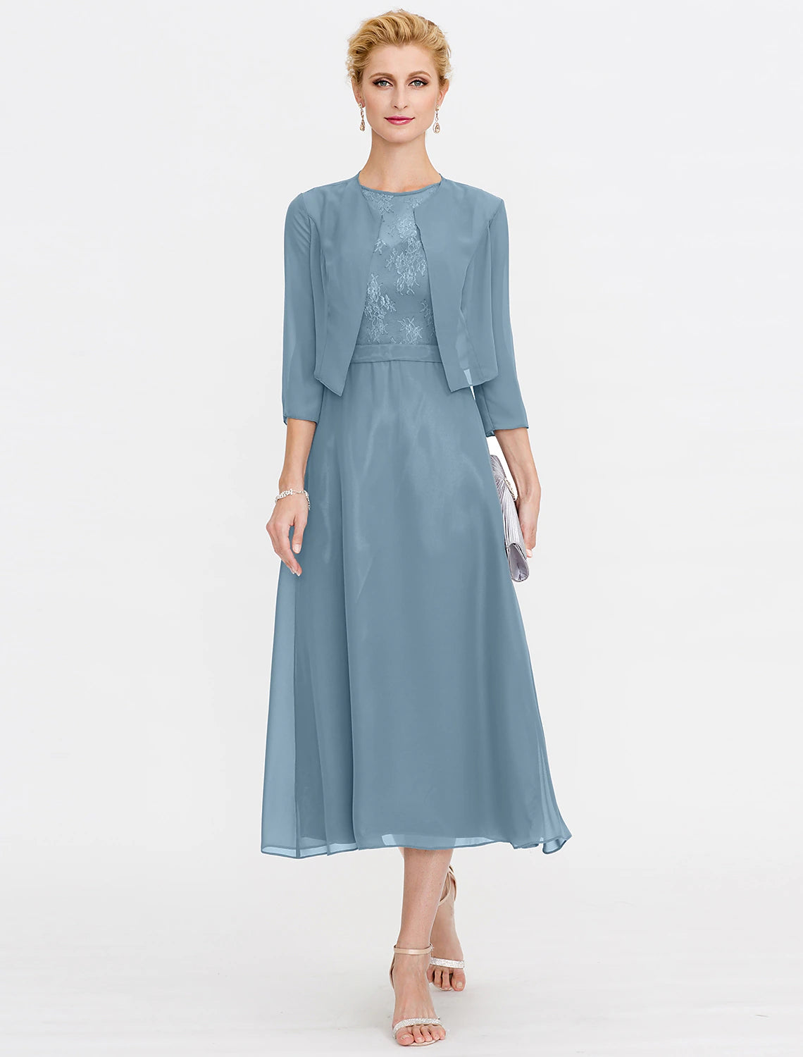 Back view of the tea length formal dress, showing pleats and flowing chiffon.