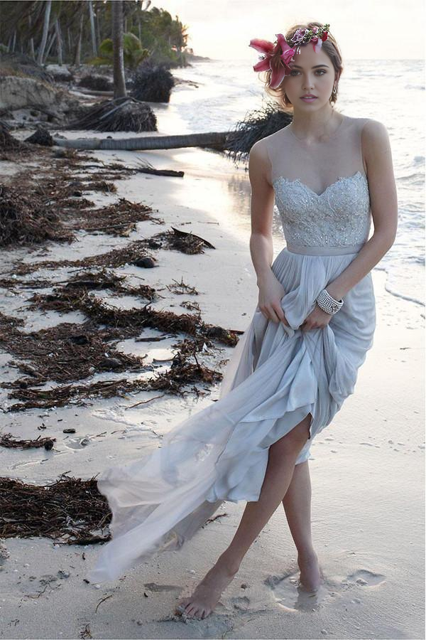 Elegant A-line lace and chiffon wedding dress with illusion V-neck and sheer back.