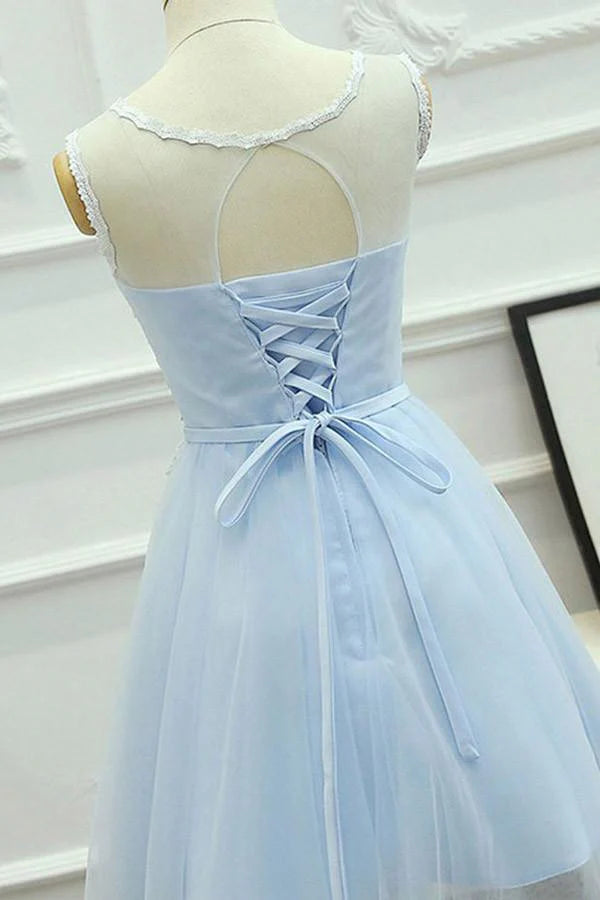 Side view of the blue A-line homecoming dress, showcasing delicate appliques on the tulle skirt.