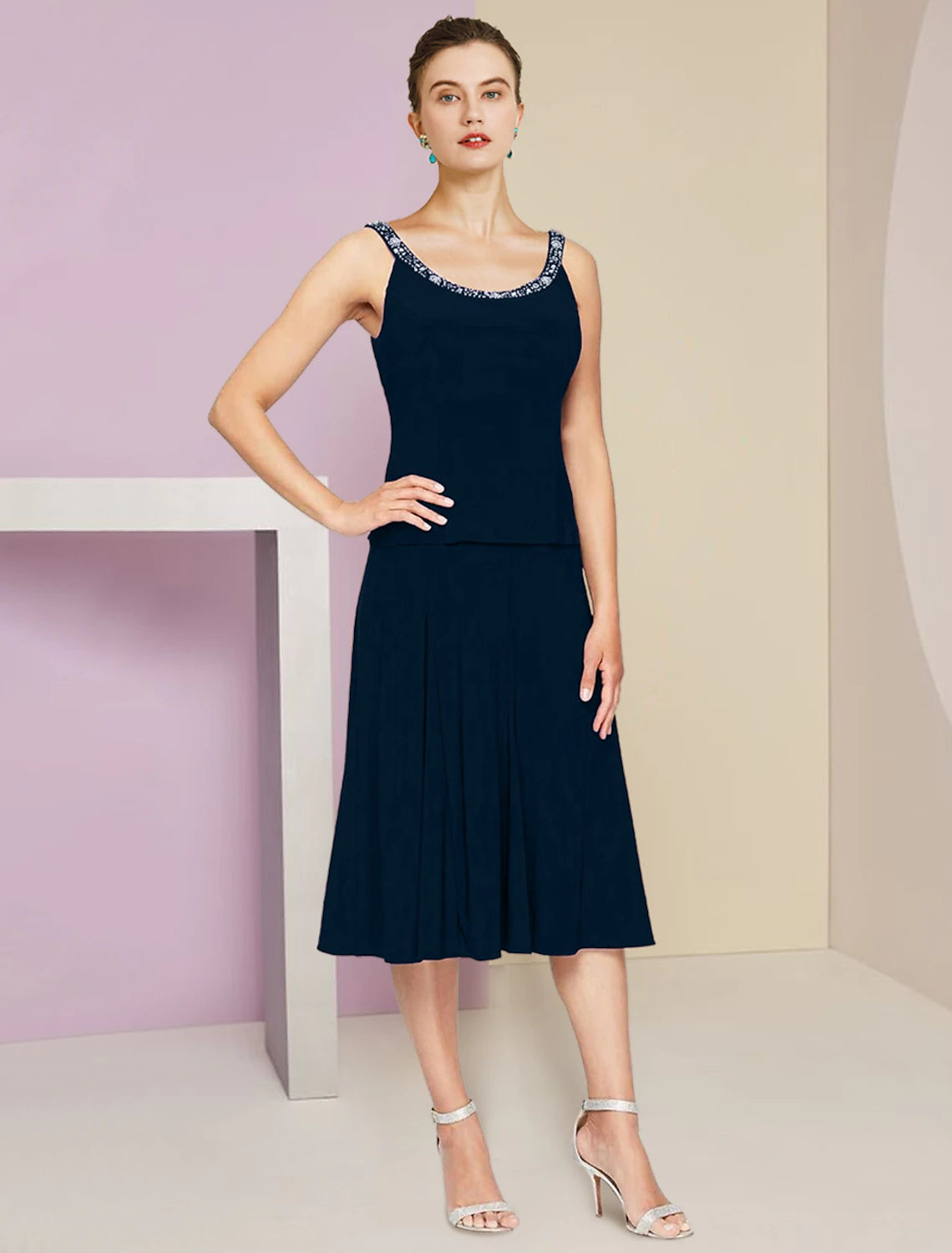 Close-up of the dress fabric, showcasing delicate pleats and sparkling crystal details.